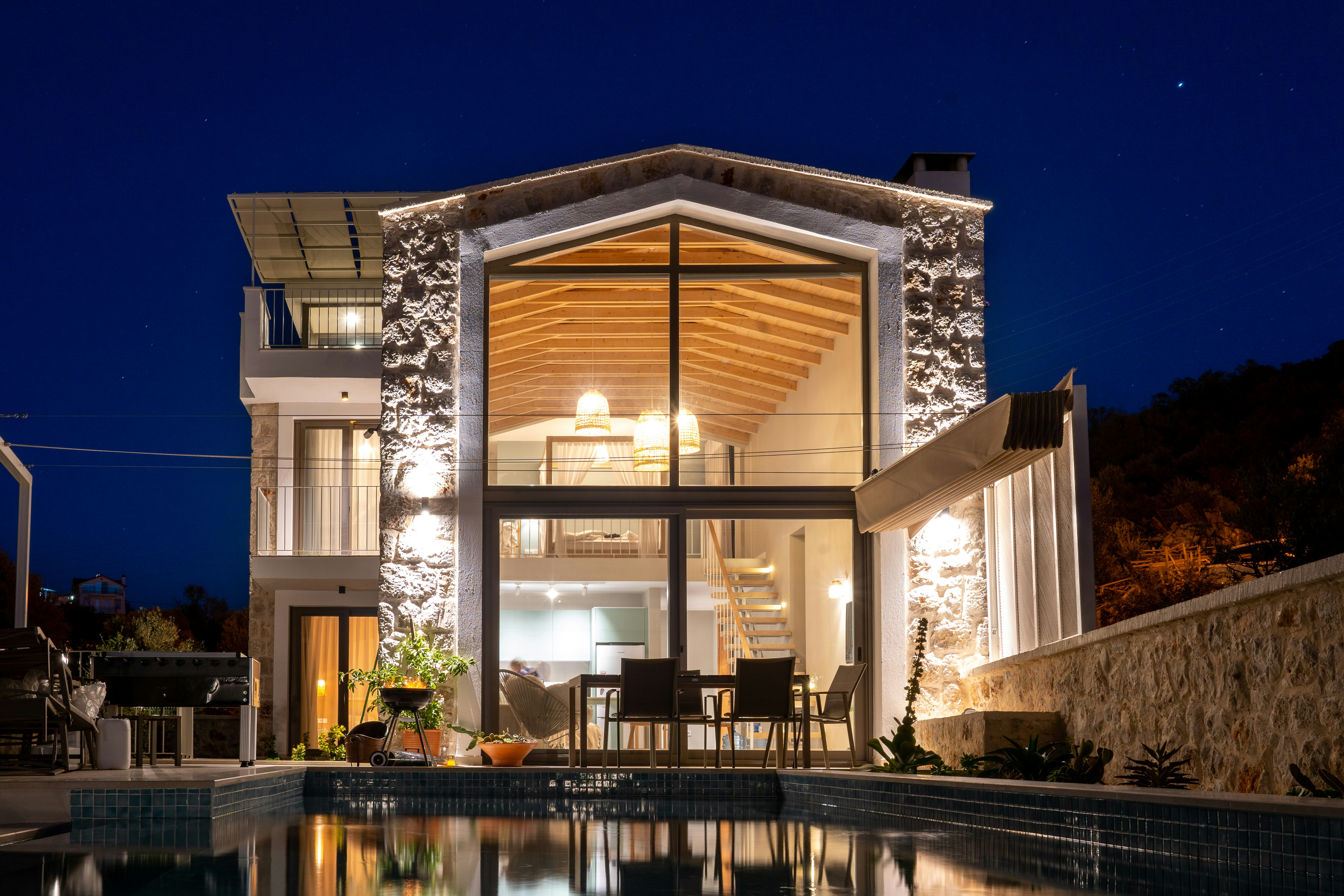 Modern luxury villa illuminated at night